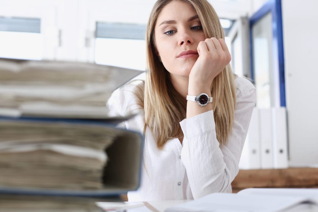 Lot of work wait for tired and exhausted woman. Huge pile of document folders, headache and depression, irs, new problems, emotion expression, vacancy or holiday dream concept